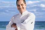 Tim Creehan poses at the beach